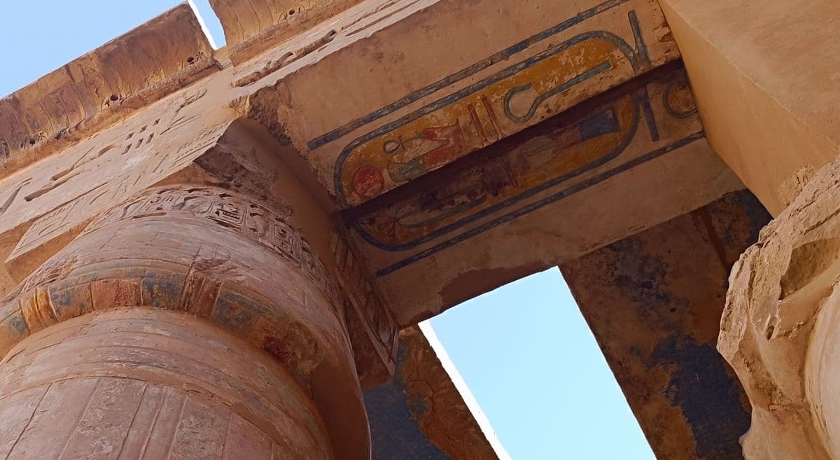 A painted ceiling, colour surviving overhead.