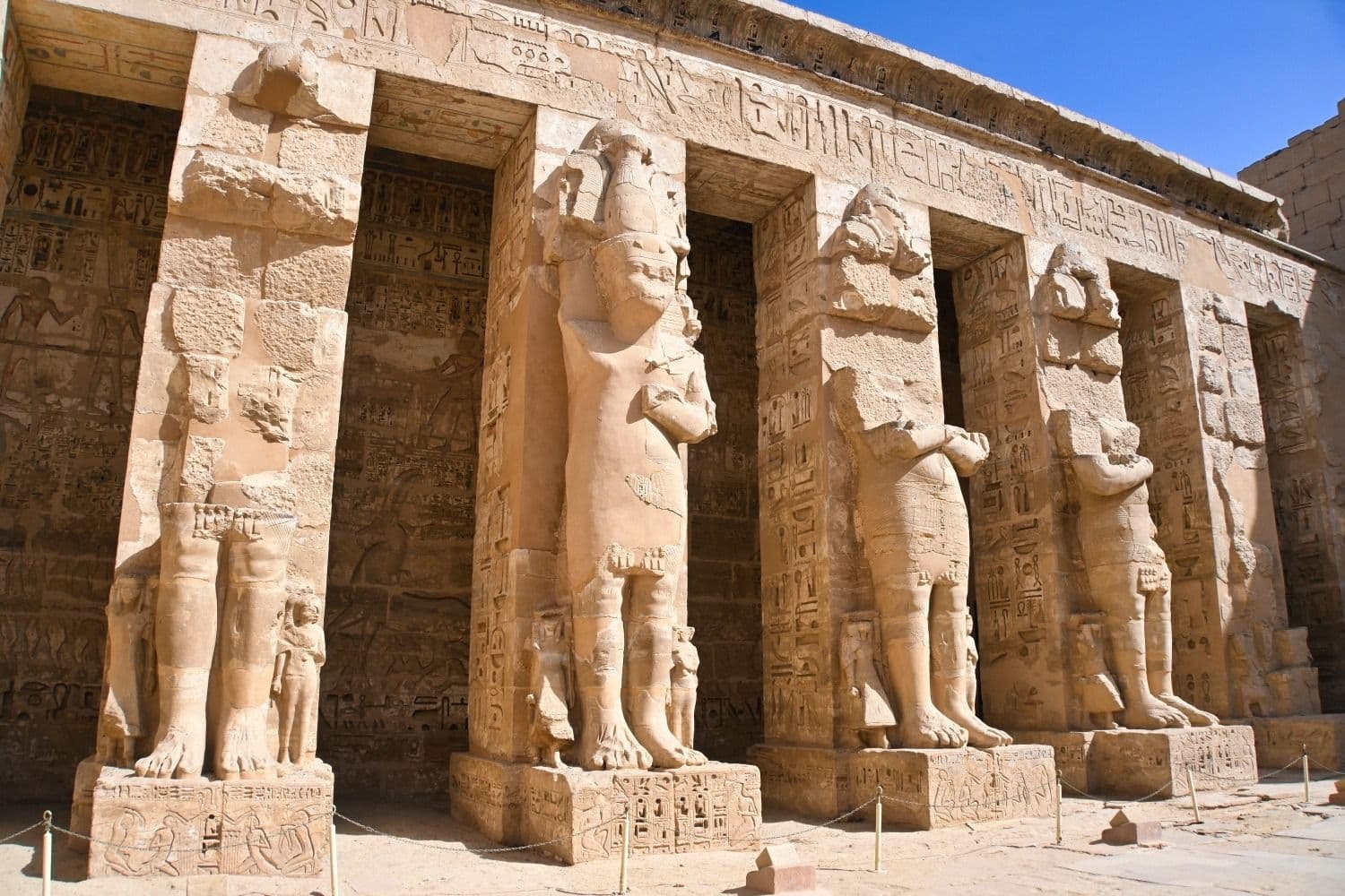 Osiride statues standing along the court.