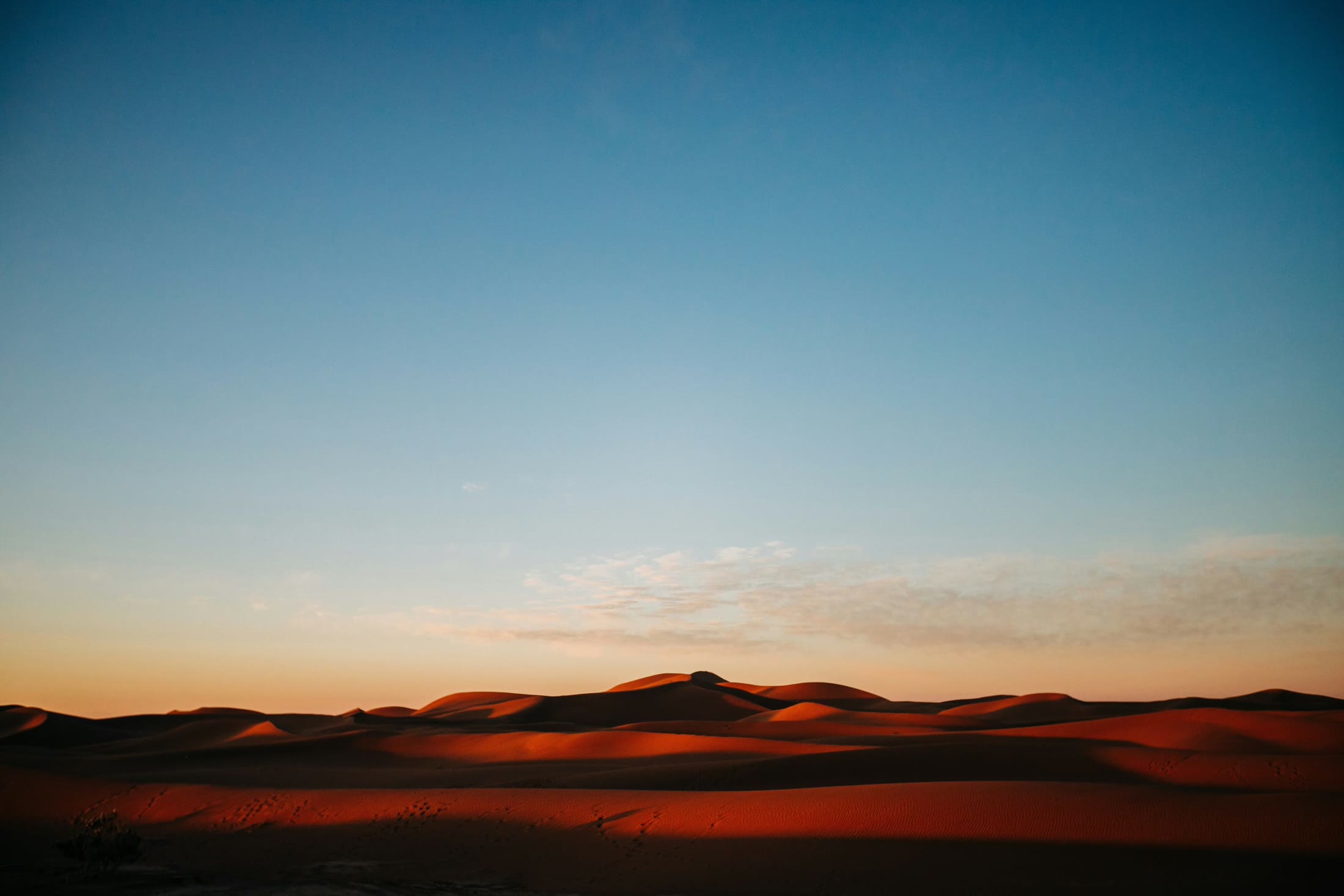 Red sand dunes at sunset