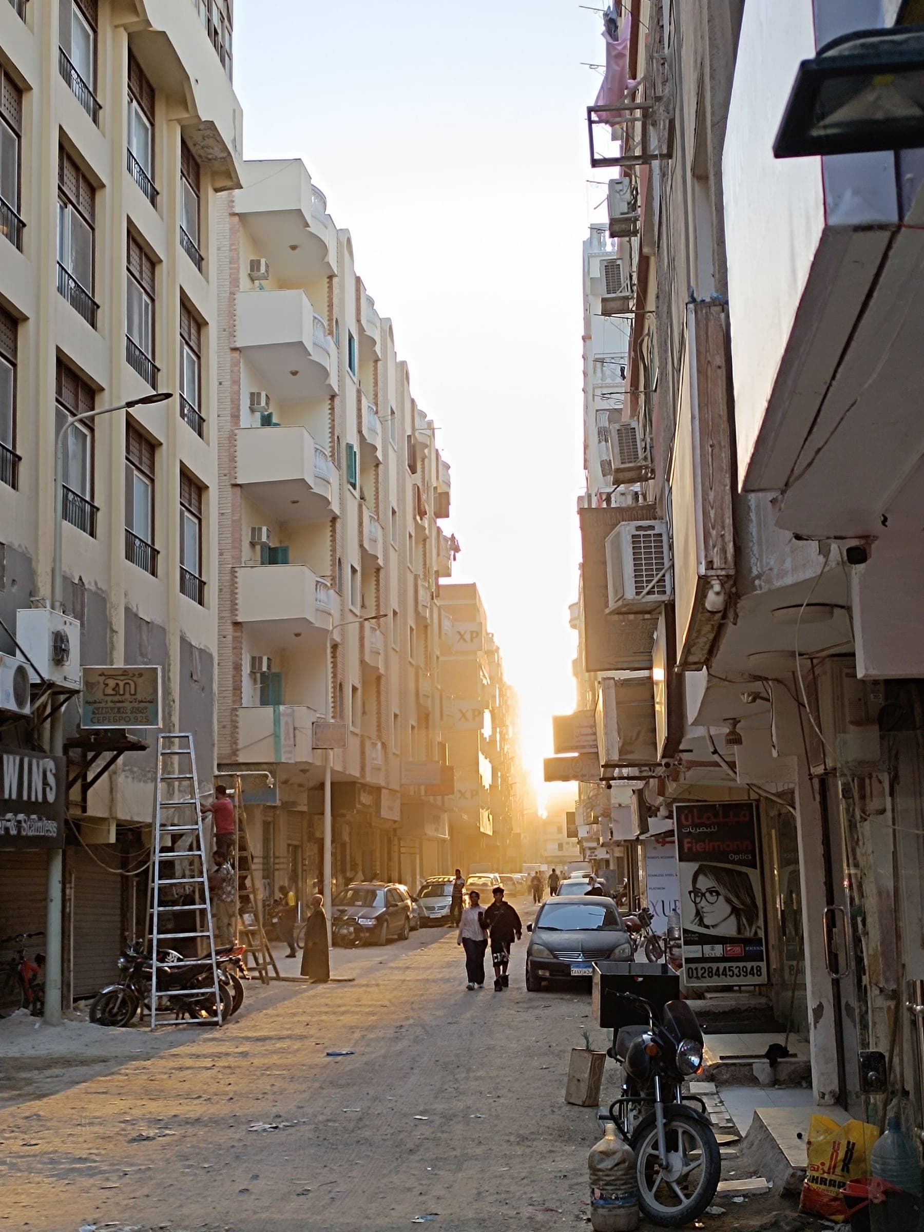 The town at the golden hour, shops and streets.